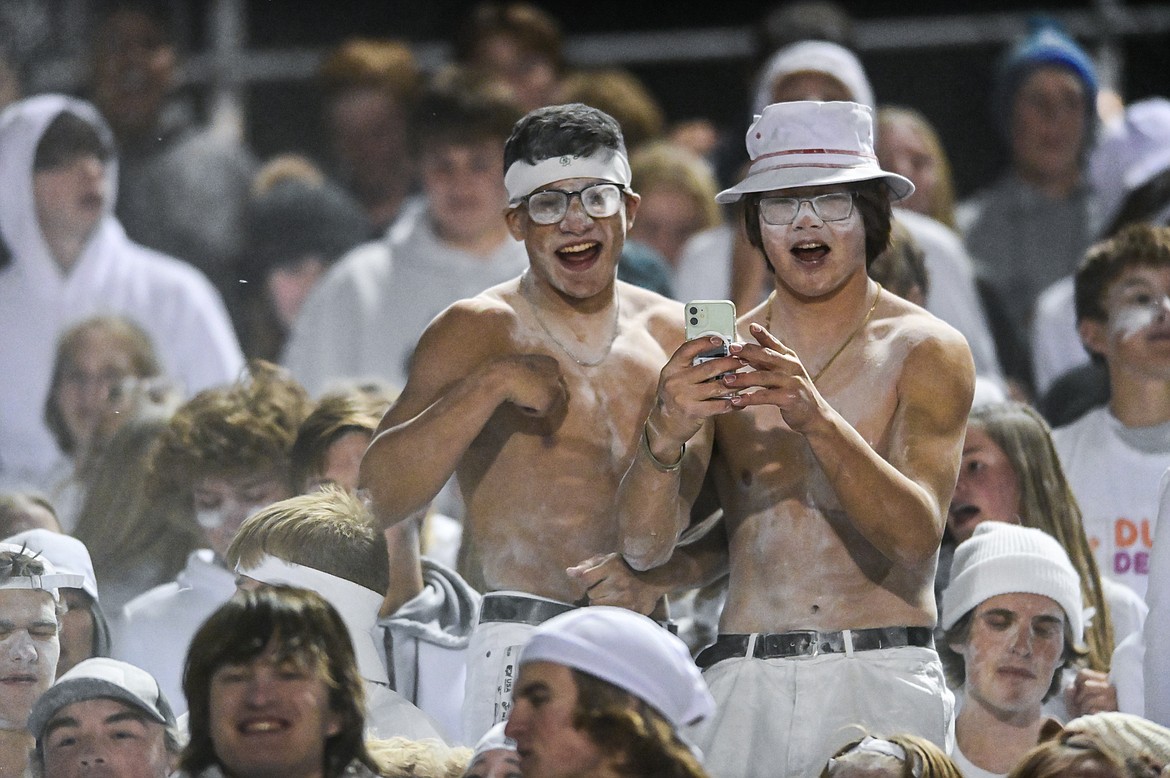 Glacier students celebrate with baby powder as the Wolfpack take on Missoula Hellgate at Legends Stadium on Thursday, Oct. 21. (Casey Kreider/Daily Inter Lake)