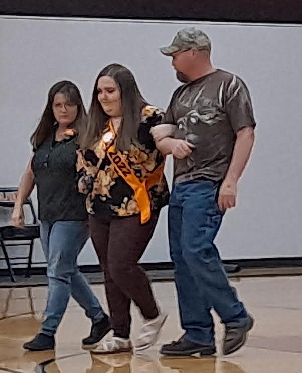 Plains volleyball manager Brea Patton was escorted by her parents Kimberly and Tim Patton during Senior Night festivities last Thursday. (Adam Lindsay/Valley Press)