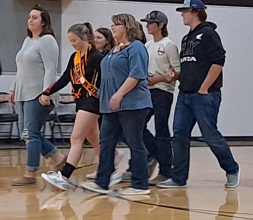 Plains volleyball player Genevieve Deschamps, was escorted by her mom Geni Deschamps, sister Jessica, her very best friends Carlie Wagoner, Drew Carey, and Will Tatum, during Senior Night festivities last Thursday. (Adam Lindsay/Valley Press)