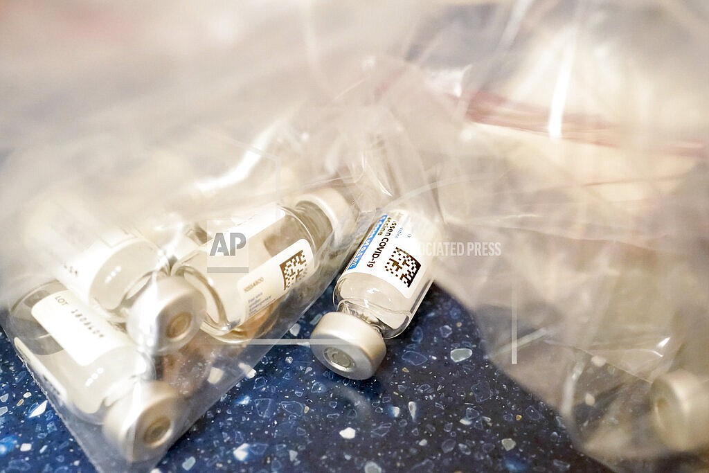 This Wednesday, March 31, 2021 file photo shows empty vials of Johnson & Johnson's one-dose COVID-19 vaccine at a mobile vaccination site in Uniondale, N.Y. On Thursday, Oct. 21, 2021, advisers to the Centers for Disease Control and Prevention are slated to discuss who should get extra doses of the Moderna or Johnson & Johnson vaccines — and the bigger question of getting a different brand for the booster than people's original vaccination. (AP Photo/Mary Altaffer)