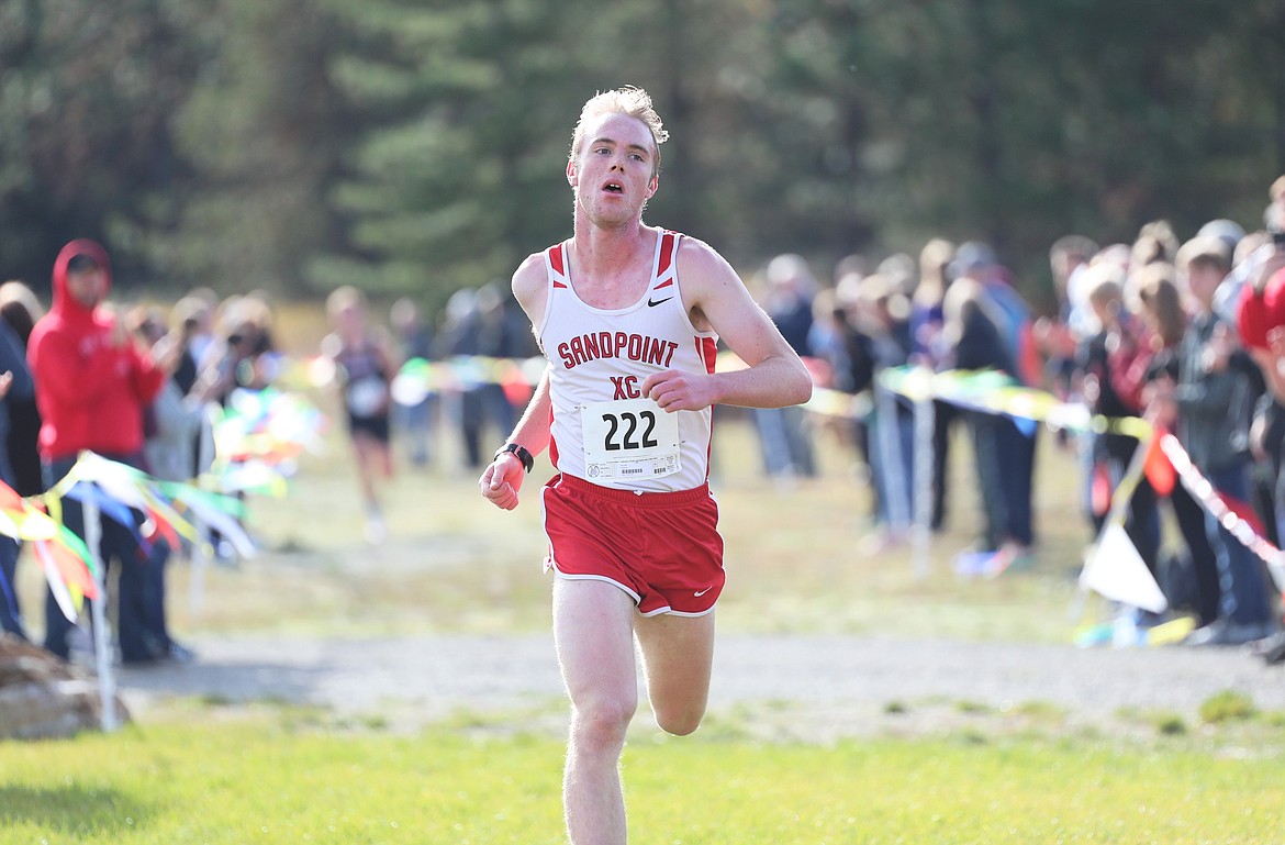 Senior Ben Ricks crosses the finish line during Thursday's regional meet. He won the individual title on the boys side.