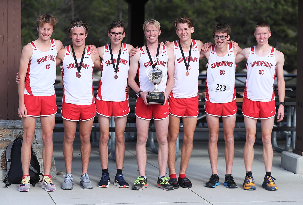 The varsity runners for the Sandpoint boys cross country team pose for a photo with the 4A Region 1 trophy on Thursday. Pictured (from left): Kasten Grimm, Slate Fragoso, Nathan Roche, Ben Ricks, Trey Clark, Daniel Ricks and Caleb Roche.