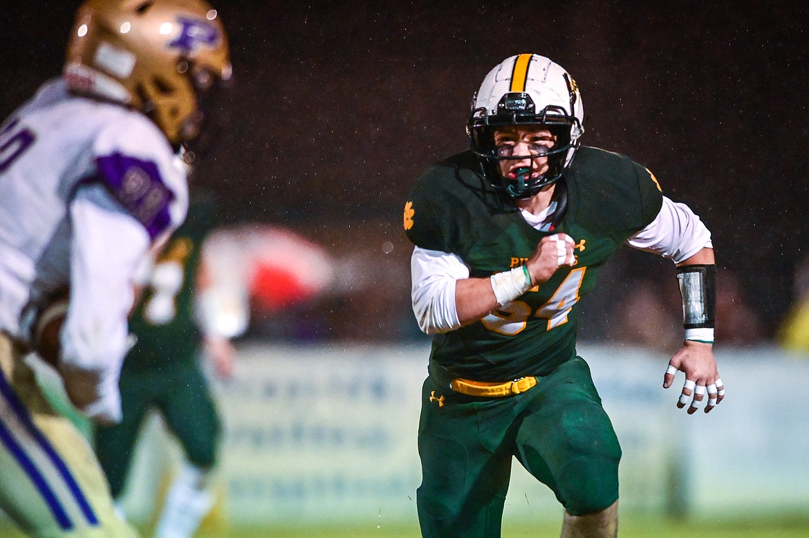 Whitefish linebacker Tanner Harmon (54) pursues Polson running back Keyen Nash (33) in the third quarter at Memorial Field in Whitefish on Friday, Oct. 22. (Casey Kreider/Daily Inter Lake)