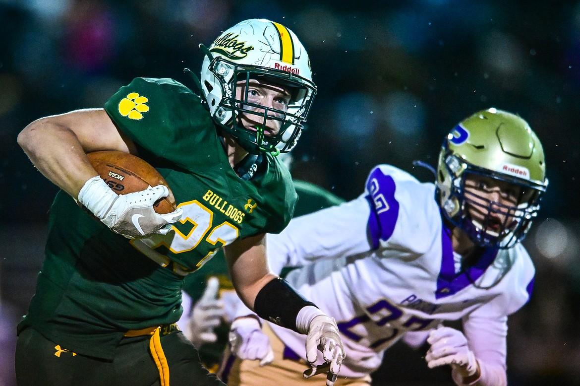 Whitefish running back Ty Schwaiger (23) looks for running room against the Polson defense in the first quarter at Memorial Field in Whitefish on Friday, Oct. 22. (Casey Kreider/Daily Inter Lake)