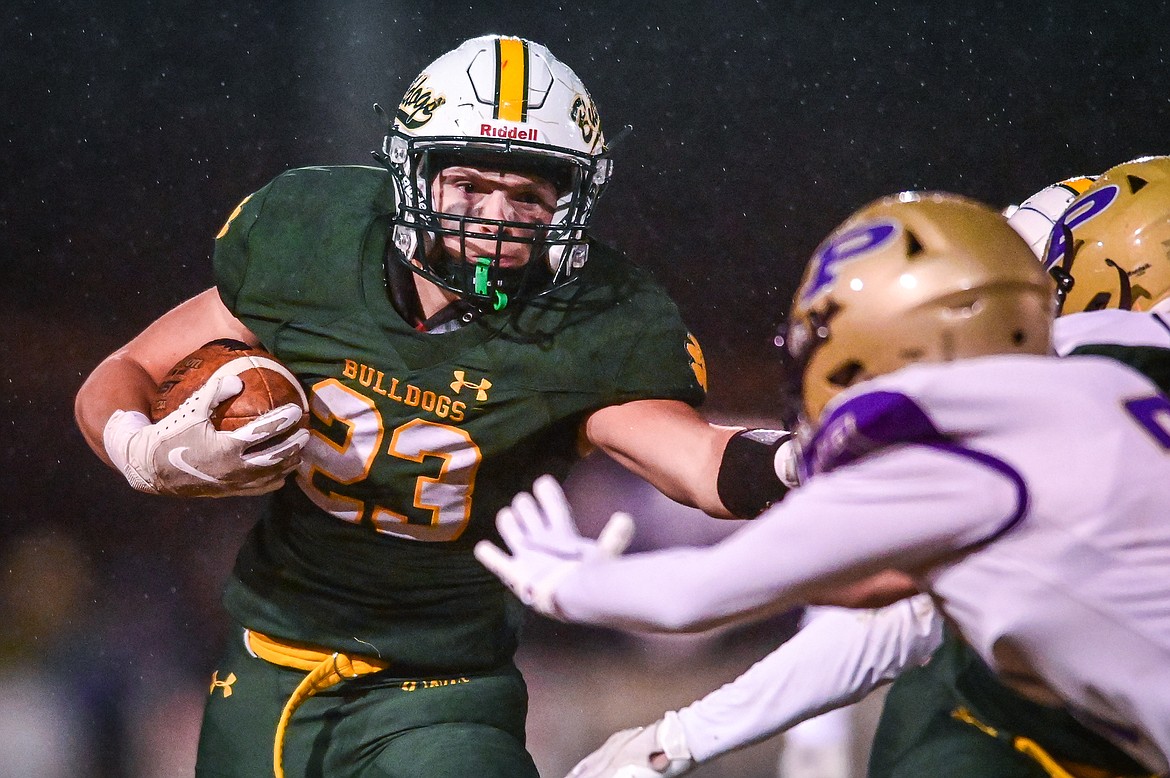 Whitefish running back Ty Schwaiger (23) looks for running room against the Polson defense in the first quarter at Memorial Field in Whitefish on Friday, Oct. 22. (Casey Kreider/Daily Inter Lake)