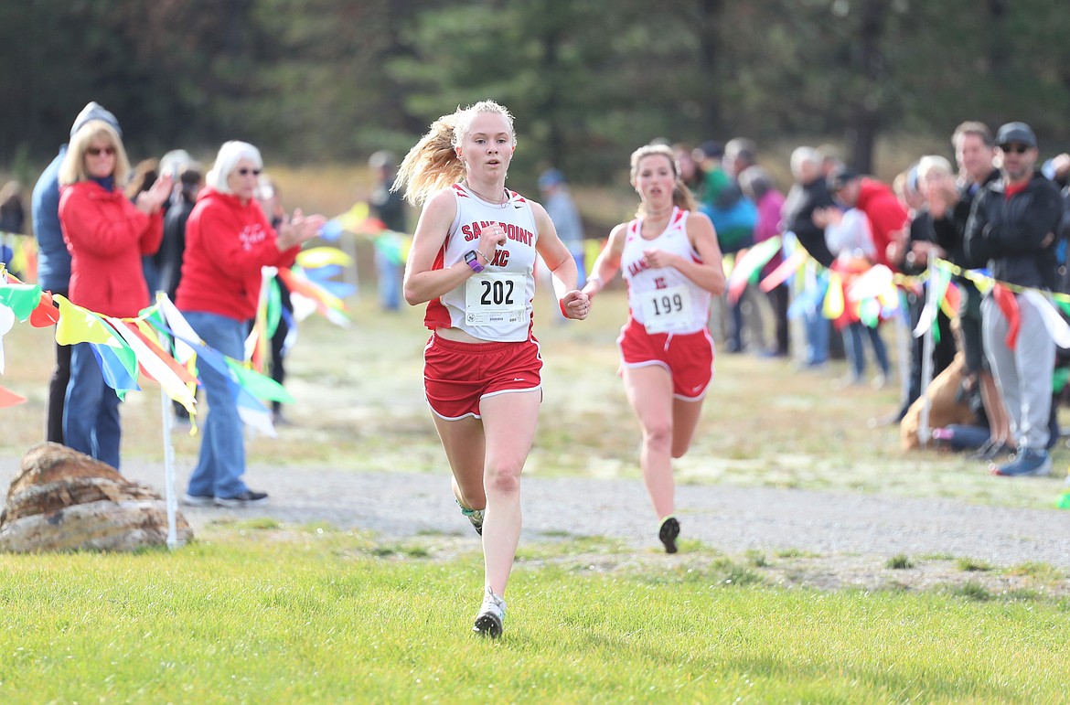 Mackenzie Suhy-Gregoire nears the finish with Megan Oulman close behind.