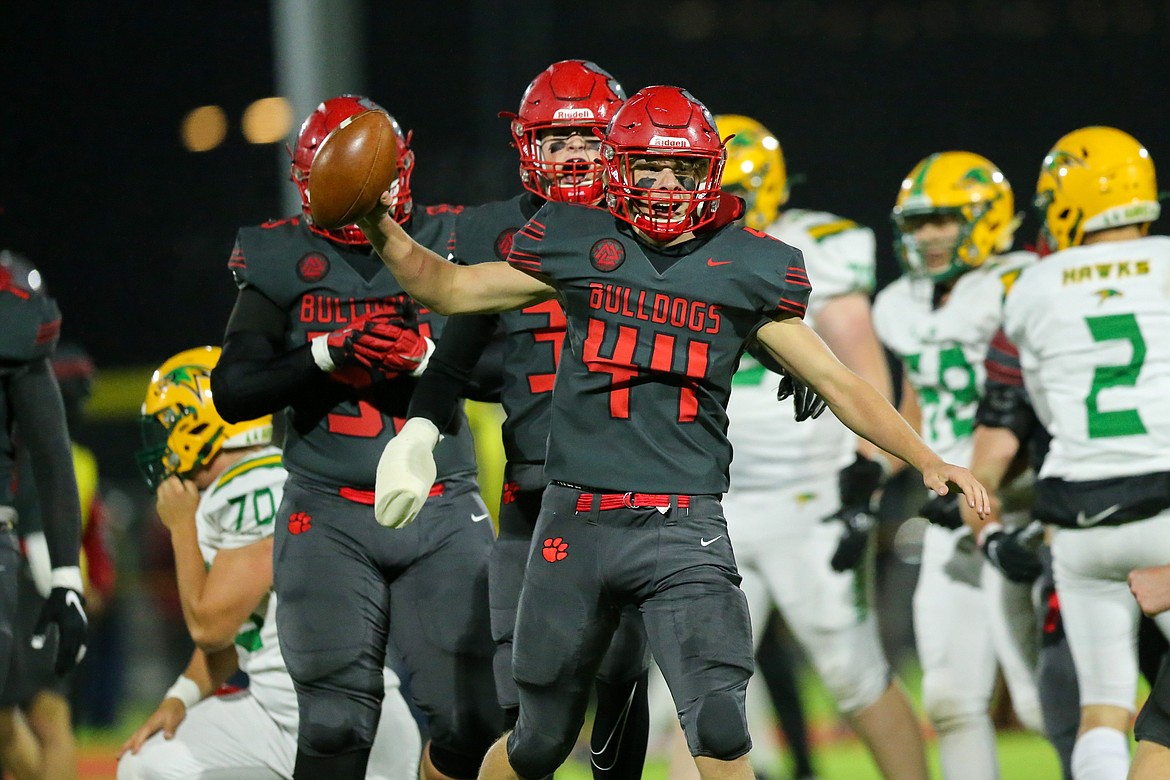 Junior Joseph Hughes recovers a fumble in the second quarter of Friday's game against Lakeland at War Memorial Field.