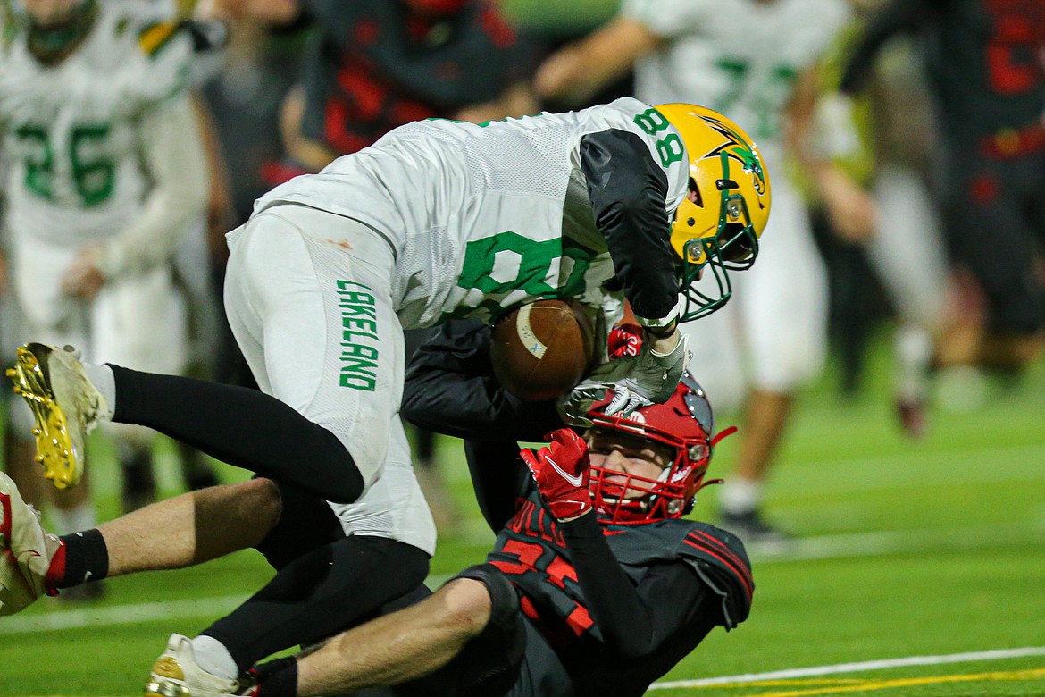 Koby Barlow breaks up a pass to Lakeland's Alden Waddington during Friday's game at War Memorial Field.