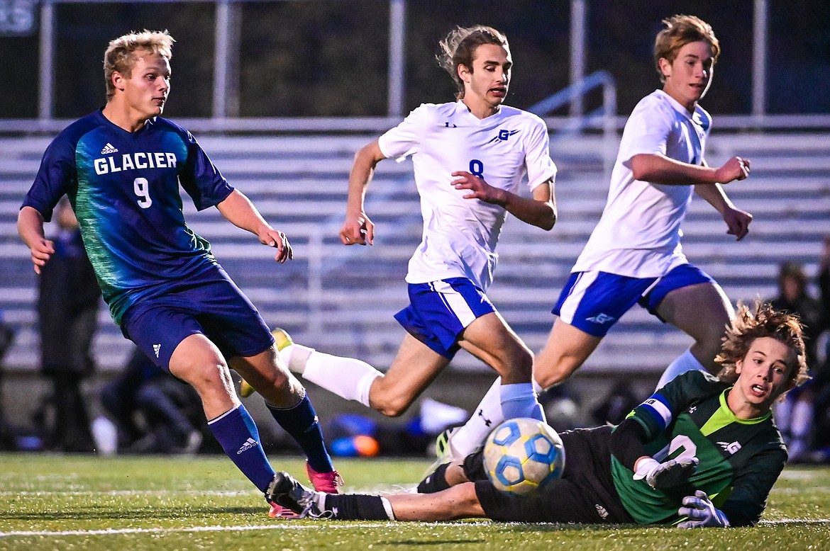 Glacier's Hunter Lisowski (9) has a shot stopped by Gallatin goalkeeper Aden Lyle (0) in the first half at Legends Stadium on Saturday, Oct. 23. (Casey Kreider/Daily Inter Lake)