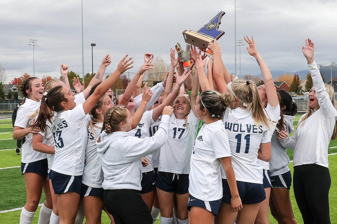 Photo by LOREN ORR PHOTOGRAPHY
Reese Ramsrud (17) and her Lake City teammates hold up the first-place trophy after the Timberwolves beat Boise to win the state 5A girls soccer championship Saturday at Rocky Mountain High in Meridian.