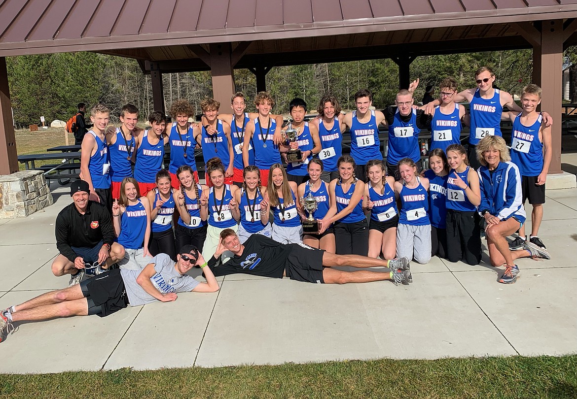 Courtesy photo
The Coeur d'Alene High boys and girls cross country teams won championships at the 5A Region 1 meet last Thursday at Farragut State Park. They will compete at the state meet Friday at Eagle Island State Park. In the front are volunteer coaches Ethan Garner and Alex Walde; kneeling from left, assistant coach Justin Taylor, Lana Fletcher, Gracie Averill, Kim Priebe, Zara Munyer, Elli Rietze, Anne Marie Dance, Kira Wood, Riley Yake, Chloe Frank, Brooklyn Brunn, Rebecca Thompson, Sara Siegler and head coach Cathy Compton; and standing from left, Cameron Hildreth, Lachlan May, Ethan Hickok, Kyle Rohlinger, Zack Cervi-Skinner, Jacob King, Max Cervi-Skinner, Will Callahan, Canyon Spencer, Josh Averett, Levi Bird, Cole Harrison, Jonny Perkins and Ezias Newell.