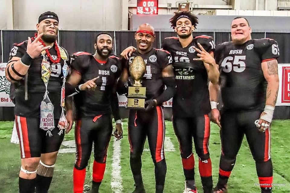 Keithon Flemming poses with his teammates and the trophy after the Tri-City Rush won the 2021 American West Football Conference (AWFC) Championship.