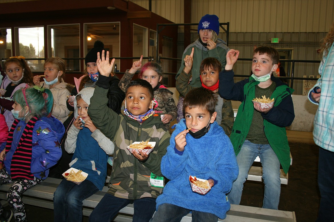 Kids eat french fries on First Grade Farm Day.