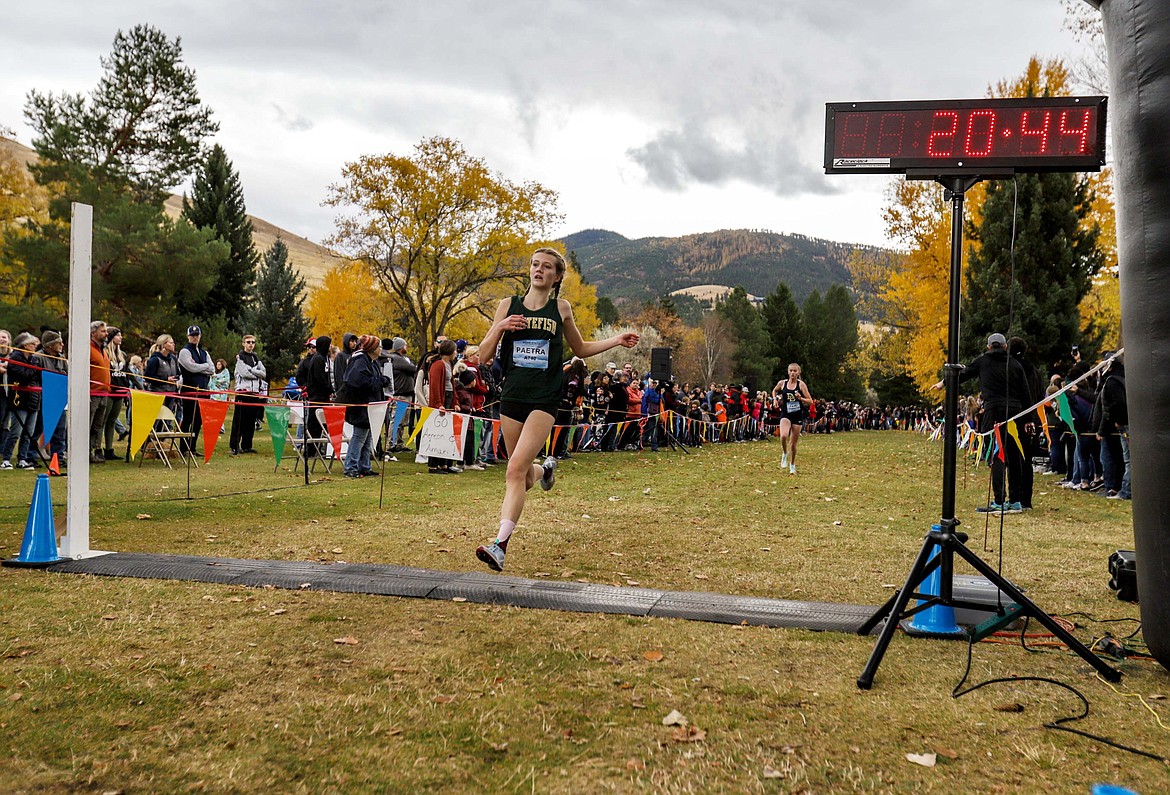 Bulldog Paetra Cooke crosses the finish line at the state championship meet in Missoula on Oct. 23. (JP Edge/Hungry Horse News)