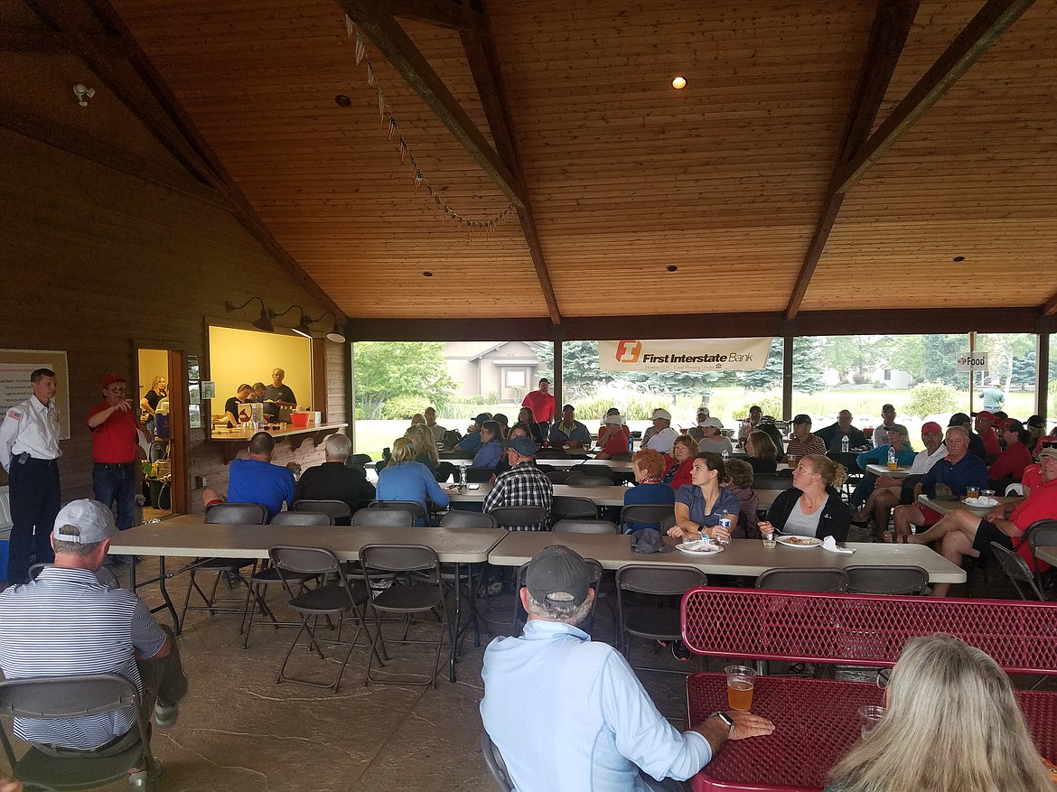 Bigfork Fire Chief Jeremy Patton and Friends of Bigfork Fire Department President Jim Sticka address a crowd at their barbecue.