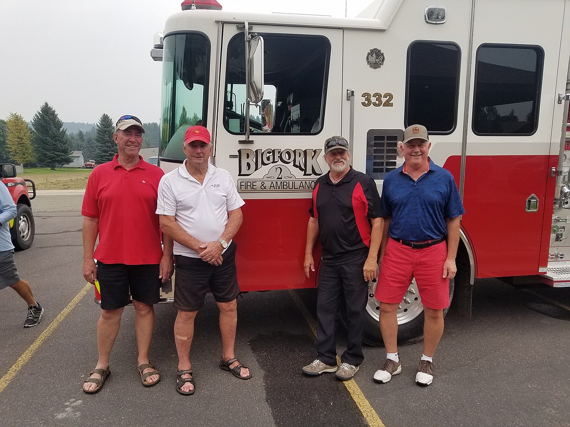 Kerry Viestenz (pictured far right) and his golfing team who won the tournament.