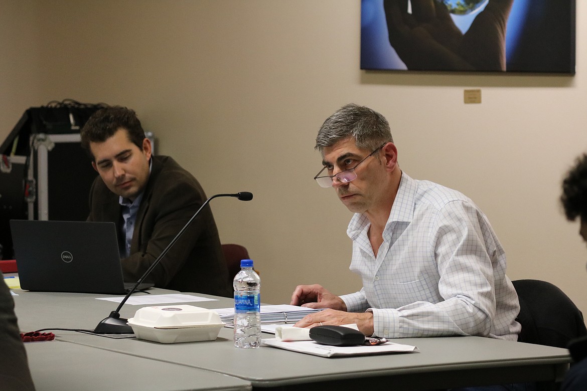 From left, Trustee Greg McKenzie and Board Chair Todd Banducci both said they would like to have additional legal counsel for the board, an action item for the meeting Wednesday, at the special meeting of the North Idaho College Board of Trustees Monday night at NIC's main campus. HANNAH NEFF/Press