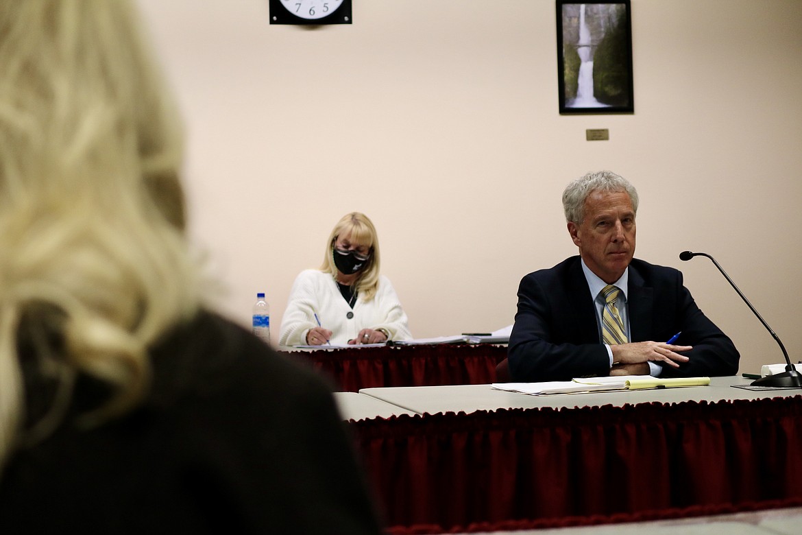 North Idaho College Trustees Todd Banducci and Greg McKenzie said they would like to have additional legal counsel for the board in addition to college attorney Marc Lyons, pictured on far right at the special board meeting Monday night at NIC's main campus. HANNAH NEFF/Press