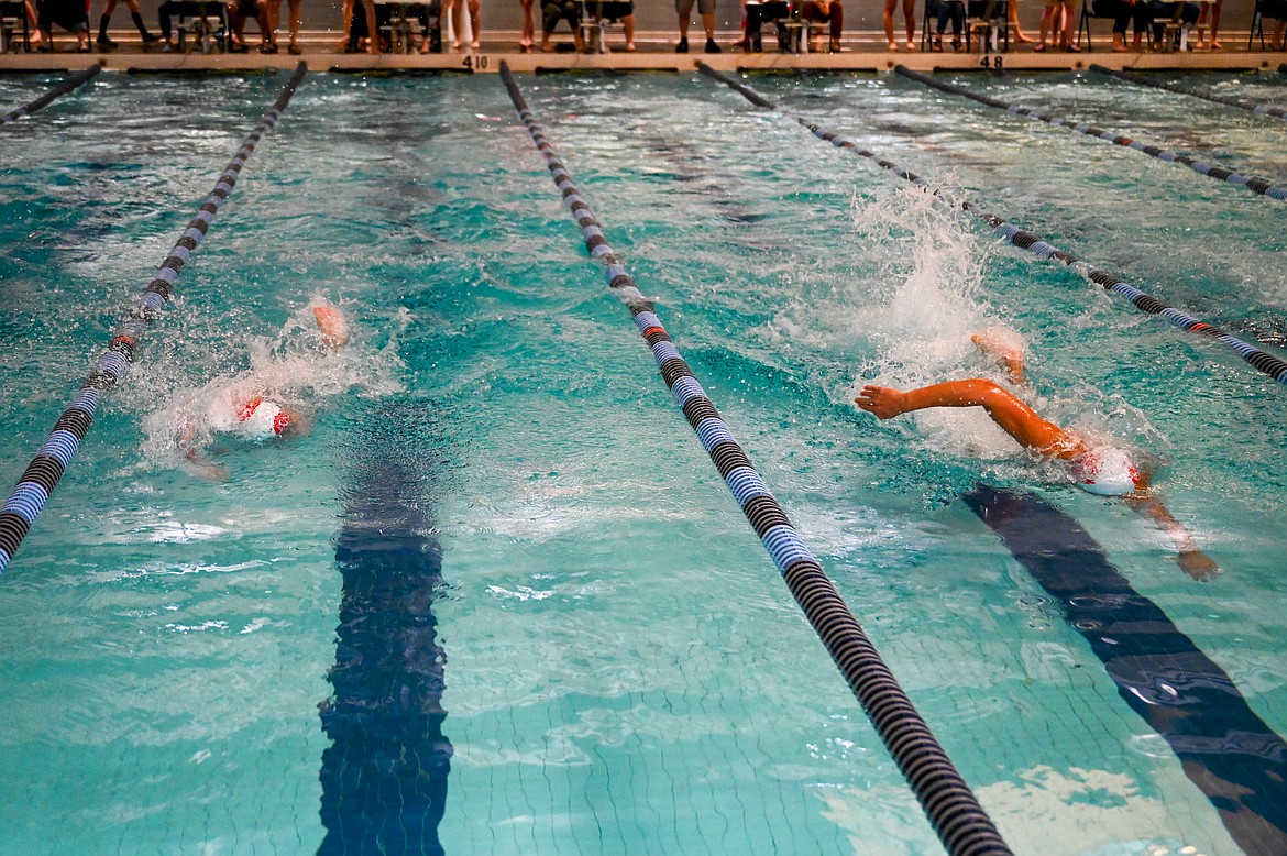 Jack Grzincic (left) and Caleb Norling compete in the 200-yard freestyle on Friday.