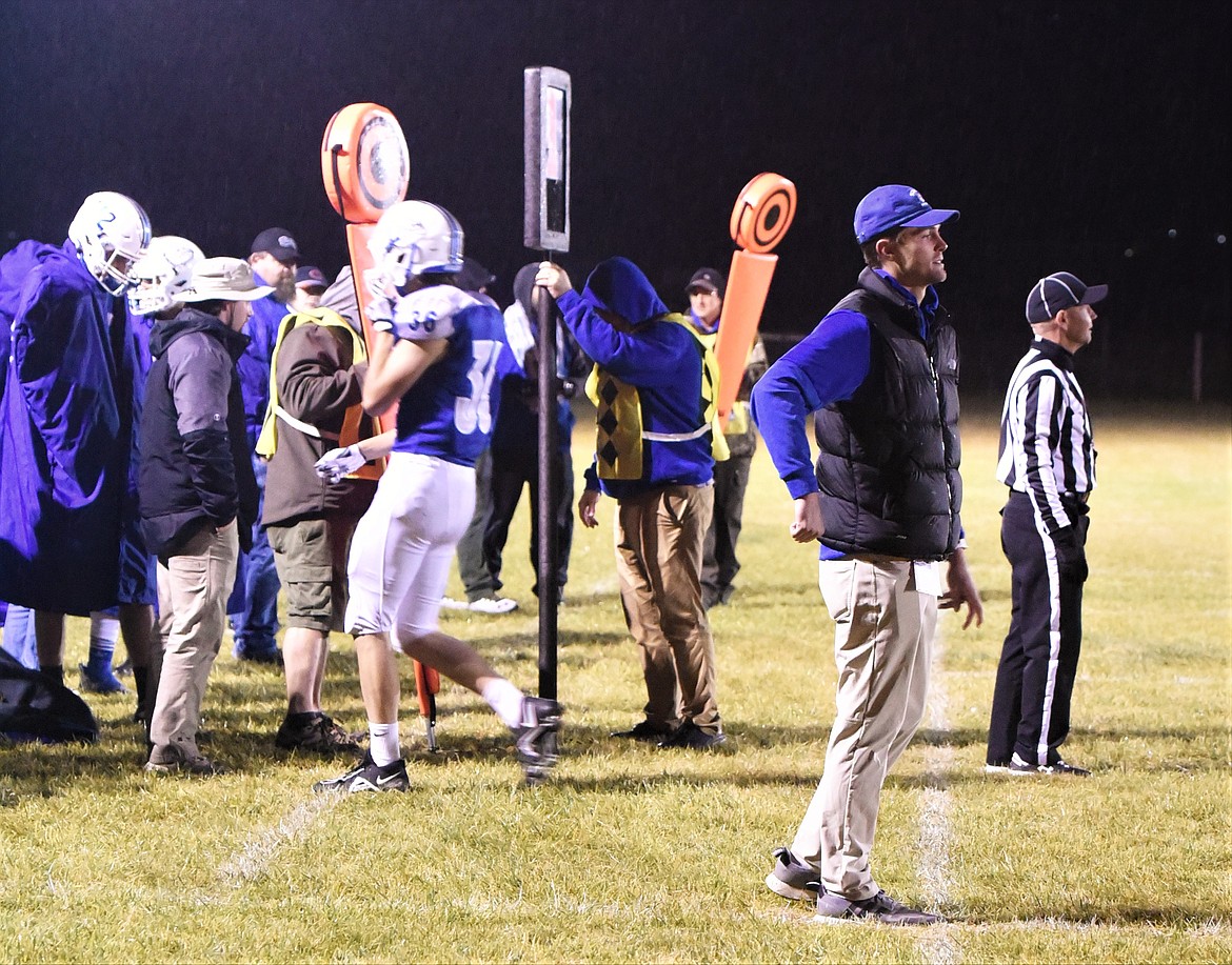 First-year head coach Carson Oakland signals in a play to his offense. (Scot Heisel/Lake County Leader)