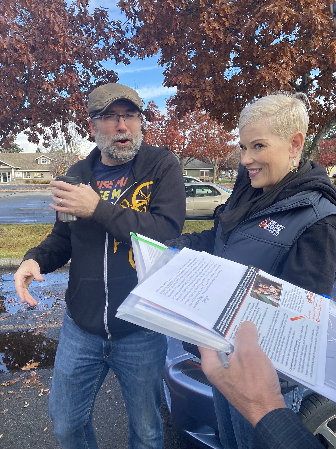 Jason and Karen Lauritzen gear-up for a day of door-knocking, hoping to inspire voters to visit the polls on November 2.