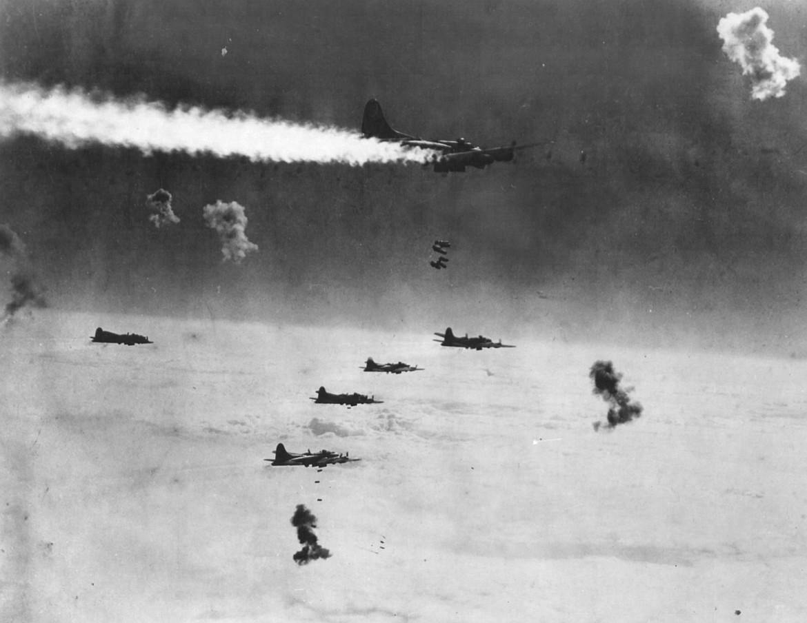 B-17 formation flying through flak while dropping bombs on Berlin (1944).