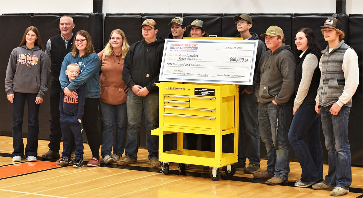 Casey Lunceford and a group of his students pose with the tool box he was awarded Monday from Harbor Freight. (Scot Heisel/Lake County Leader)