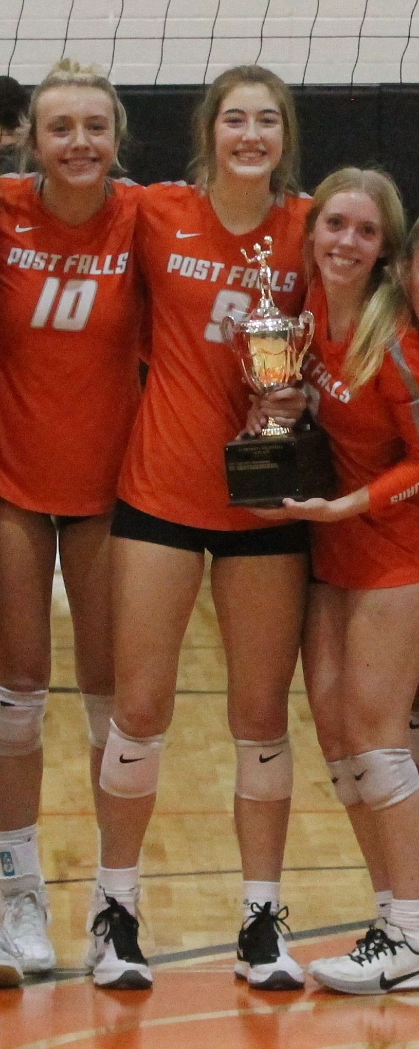 MARK NELKE/Press
From left, Kylee Munday, Rylee Hartwig and Kassie Gardiner after Post Falls won the 5A Region 1 volleyball title last week at The Arena.