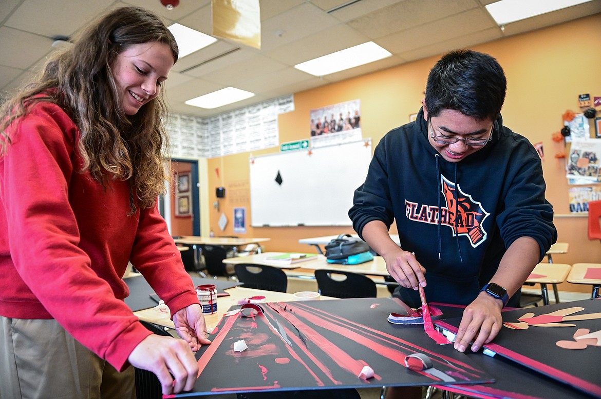 Neila Lyngholm and Vincent Lam work on posters for their informative speech at Flathead High School on Wednesday, Oct. 27. (Casey Kreider/Daily Inter Lake)