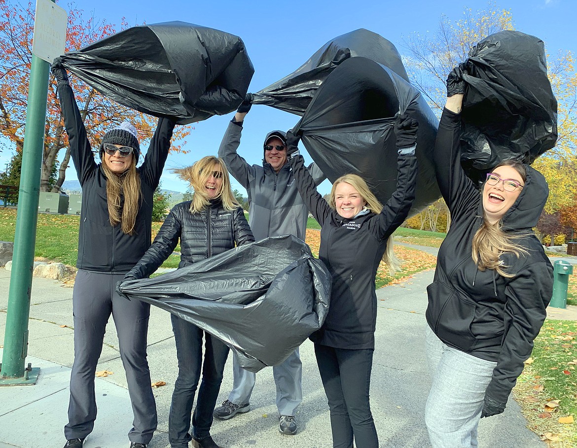 Hagadone Marine Group and Lake Coeur d'Alene Cruises led the annual Fall Lake Cleanup Day on Wednesday at City Beach. From left, Melissa Menke
Amy Kobrick, John Baker, Carly Goodlander and Ashley Orosco prepare to head out and pick up litter.