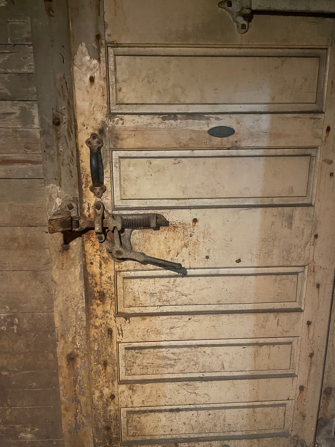 An old freezer door in the basement of the Metals that harkens back to the building's history as a meat distributor.