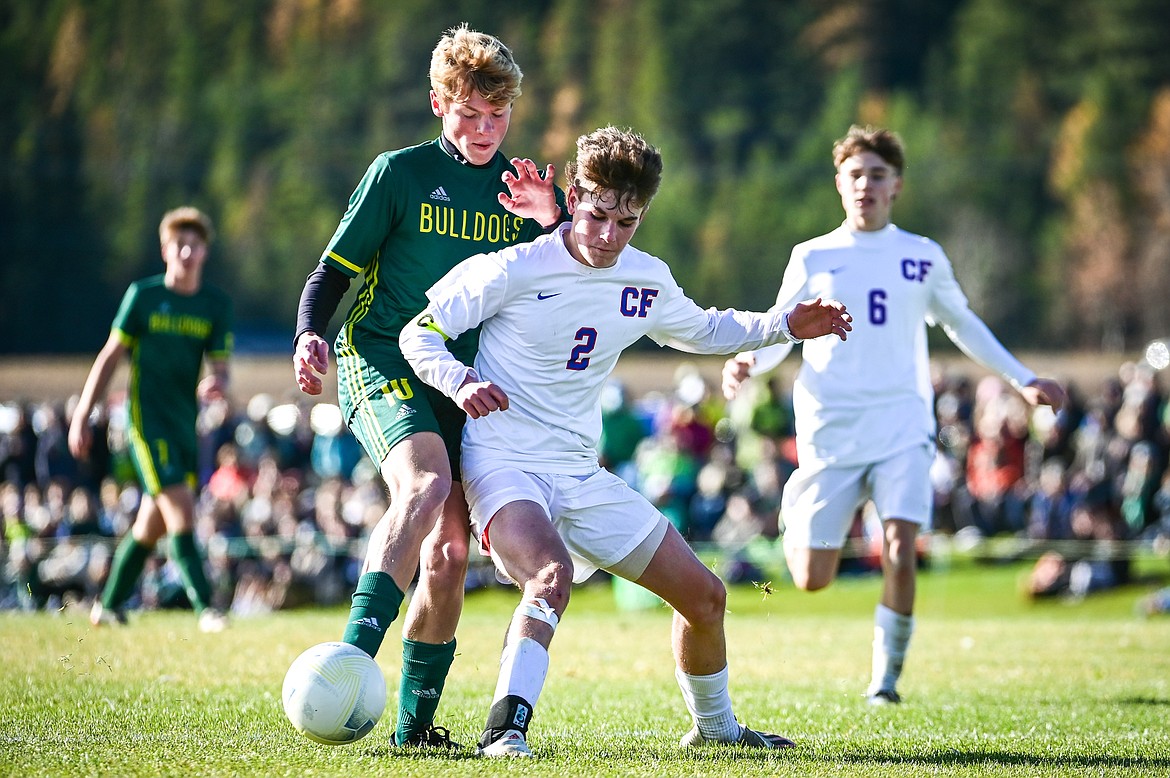 Whitefish's Jackson Dorvall (10) and Columbia Falls' Walt Nichols (2) battle for possession in the first half of the State A championship at Smith Fields on Saturday, Oct. 30. (Casey Kreider/Daily Inter Lake)