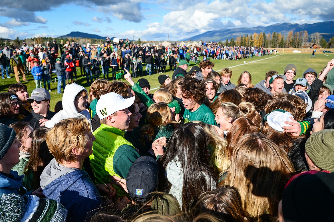 Whitefish players celebrate with their student section after the Bulldogs' 3-2 win over Columbia Falls in the State A championship at Smith Fields on Saturday, Oct. 30. (Casey Kreider/Daily Inter Lake)