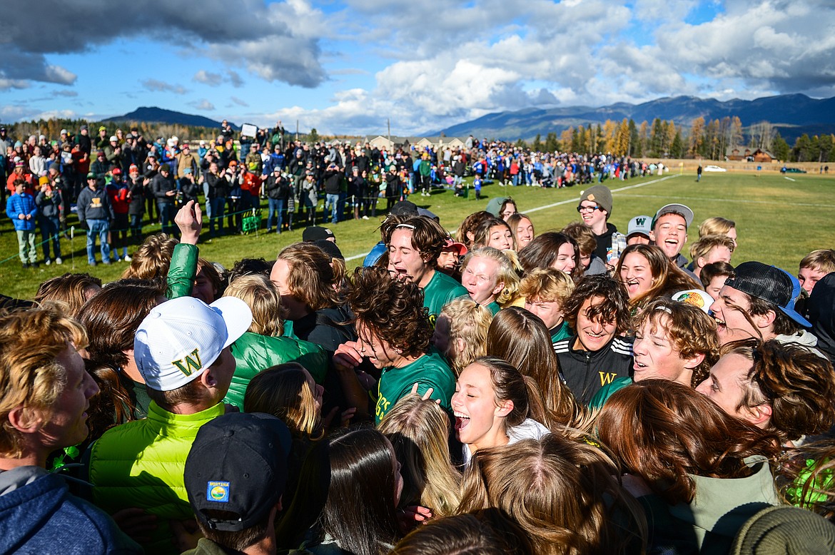 Whitefish players celebrate with their student section after the Bulldogs' 3-2 win over Columbia Falls in the State A championship at Smith Fields on Saturday, Oct. 30. (Casey Kreider/Daily Inter Lake)