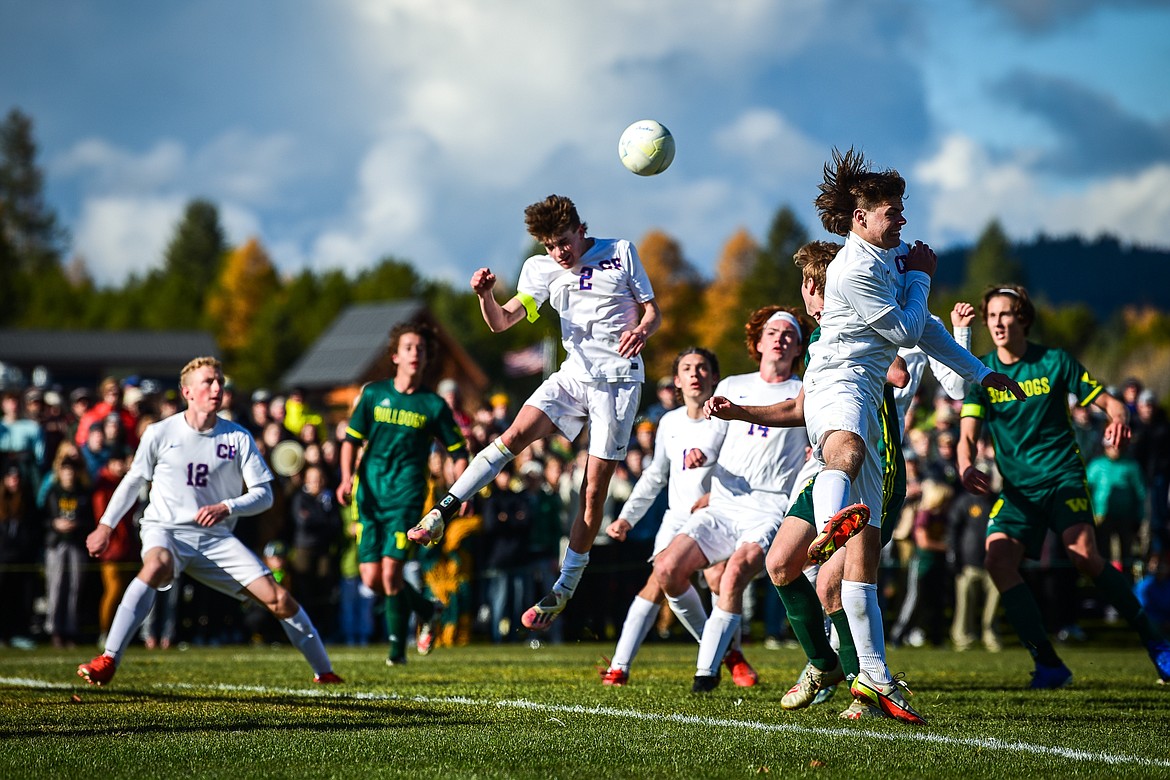 Columbia Falls' Walt Nichols (2) heads a Whitefish corner kick out of the box in the second half of the State A championship at Smith Fields on Saturday, Oct. 30. (Casey Kreider/Daily Inter Lake)