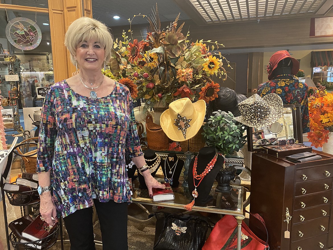 Post Falls resident Lynn Rinker suffered the loss of her home in a fire just after Christmas, 2020. Rising from the ashes, Rinker has rebounded and is shown here in the middle of her shop 'Memory Lane,' located in the Resort Shops plaza.