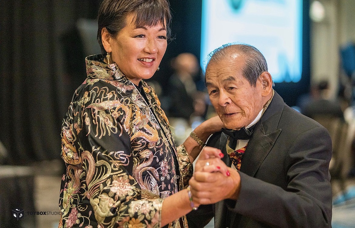 Delia Freney dances a samba with her father, George Dong, at a gala dinner following a ceremony presenting Wong and other Chinese American soliders with the Congressional Gold Medal.