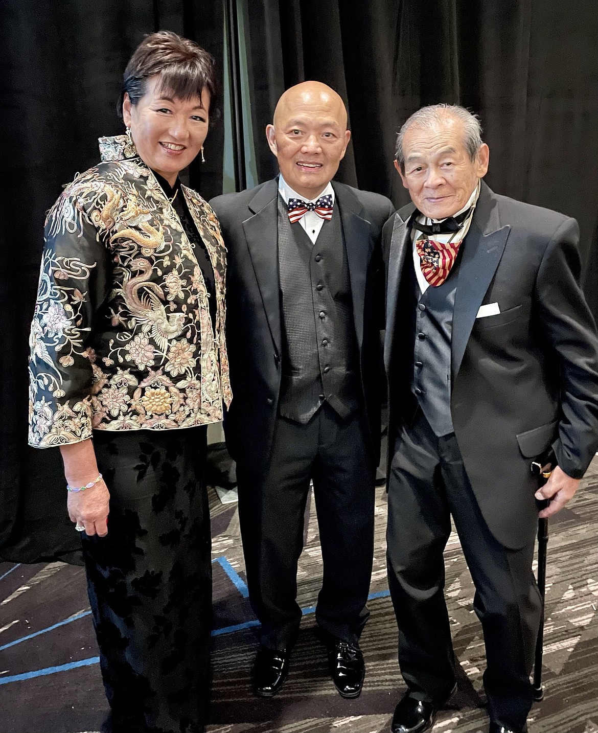 George Dong, right, is pictured at a ceremony presenting the Congressional Gold Medal awarded to Chinese American veterans of World War II. "There were four living veterans receiving this award," said Dong's daughter, Delia Freney, who also received a medal posthumously for her mother's brother, Harold Sam. "My dad wore a tuxedo as he proudly walked to center stage to receive his medal. The medals received were bronze duplicates and the actual Gold Medal was on display. It will be in the Smithsonian Museum next year."