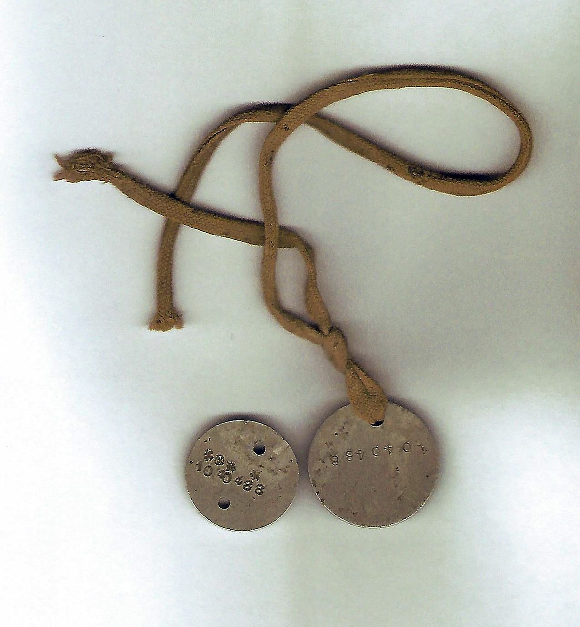 A photo of Harry F. Clark's dog tags from World War I.