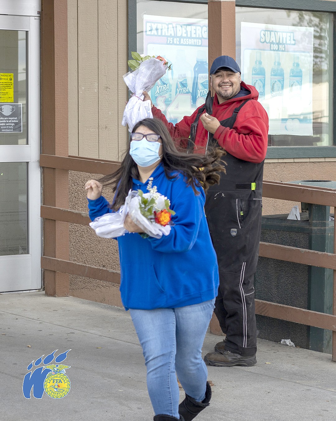 Ariana Arceta runs to find her next recipient as the man behind her smiles after receiving the bouquets on Oct. 20.