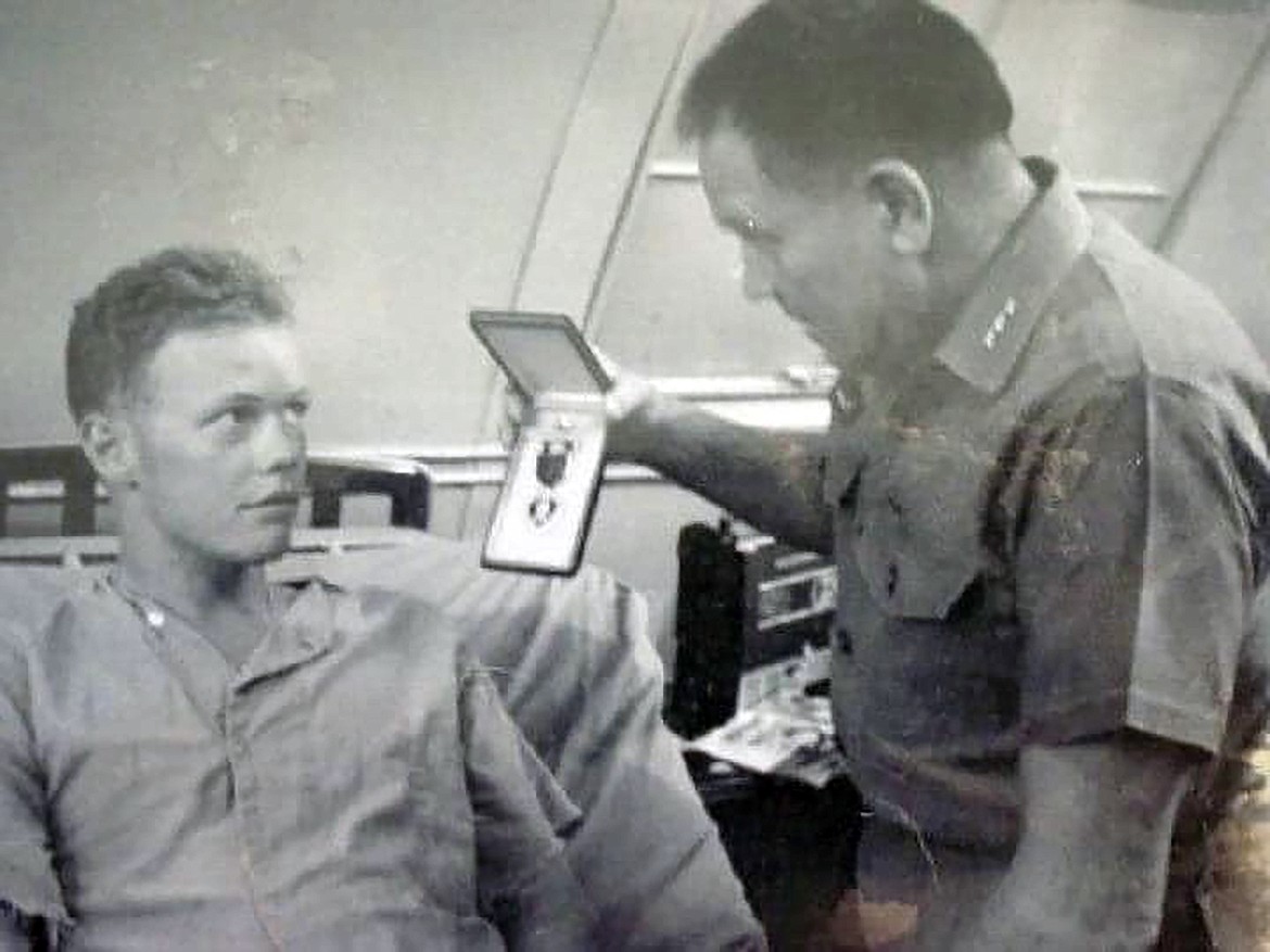Ray Calhoun is presented his Purple Heart by Lt. General Louis Walt at NSA DaNang aka China Beach in May 1967.