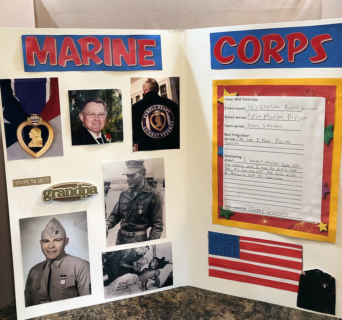 A display board created by Ronald Williams' grandson, Cooper Williams, tells of the details of his service and shows several photos from his service as well as recent photos of the Marine.