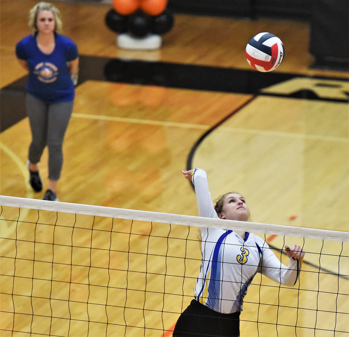 Ember Rode looks to return a ball during an Oct. 28 game against Ronan. (Scot Heisel/Lake County Leader)