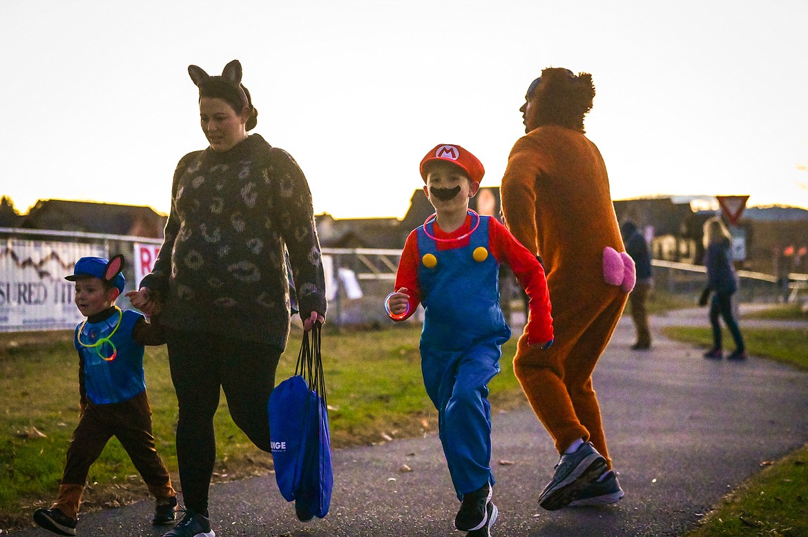 Participants make their way around Kidsports Complex during the Glow Run to raise money for the Nate Chute Foundation on Saturday, Oct. 30. (Casey Kreider/Daily Inter Lake)