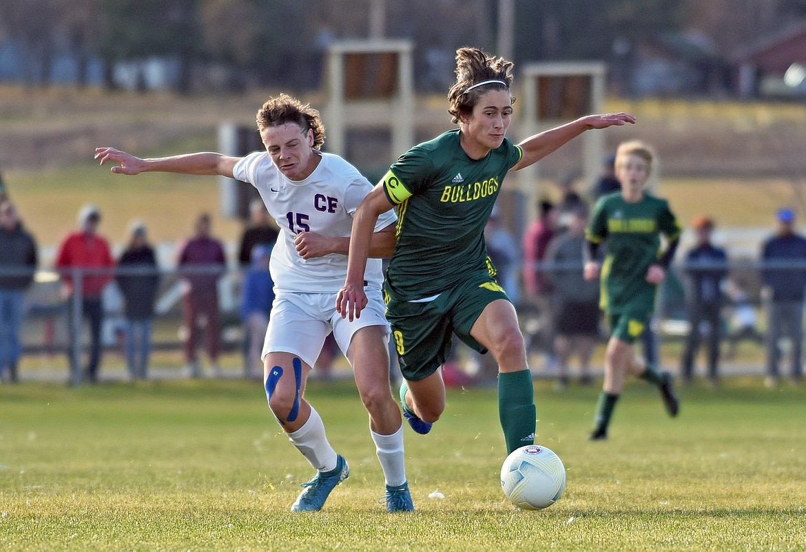 Whitefish senior Gabe Menicke battles with Wildcat Preston Trenerry during the State A Championship against Columbia Falls on Saturday in Whitefish. (Whitney England/Whitefish Pilot)