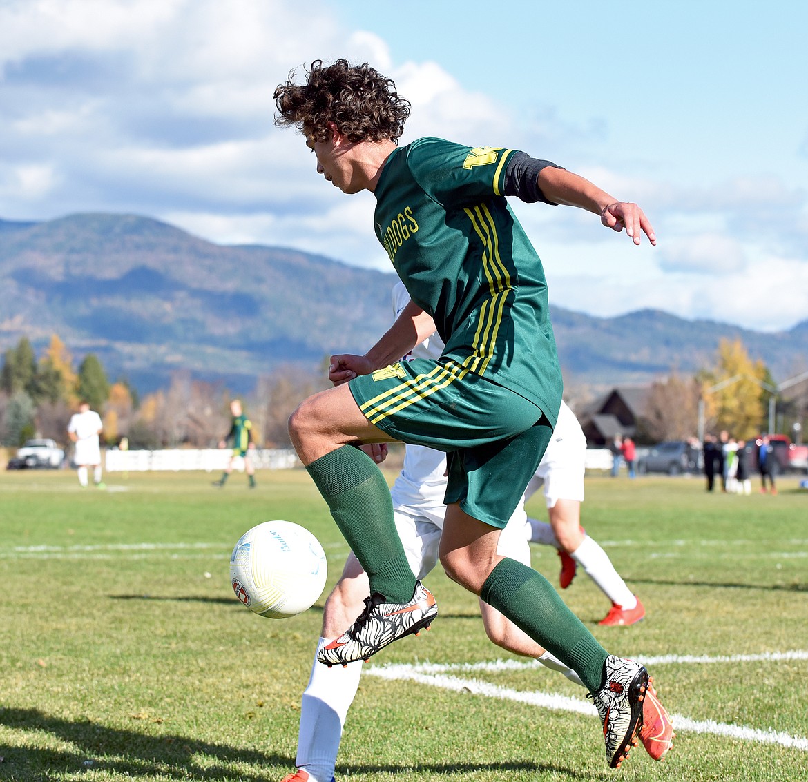 Whitefish midfielder Luke Roberts controls the ball along the end line during the State A Championship against Columbia Falls on Saturday in Whitefish. (Whitney England/Whitefish Pilot)