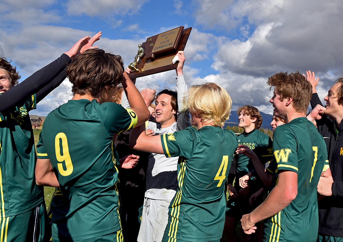 The Whitefish Bulldog boys soccer team celebrates winning its fourth-straight State A Championship on Saturday in Whitefish. (Whitney England/Whitefish Pilot)