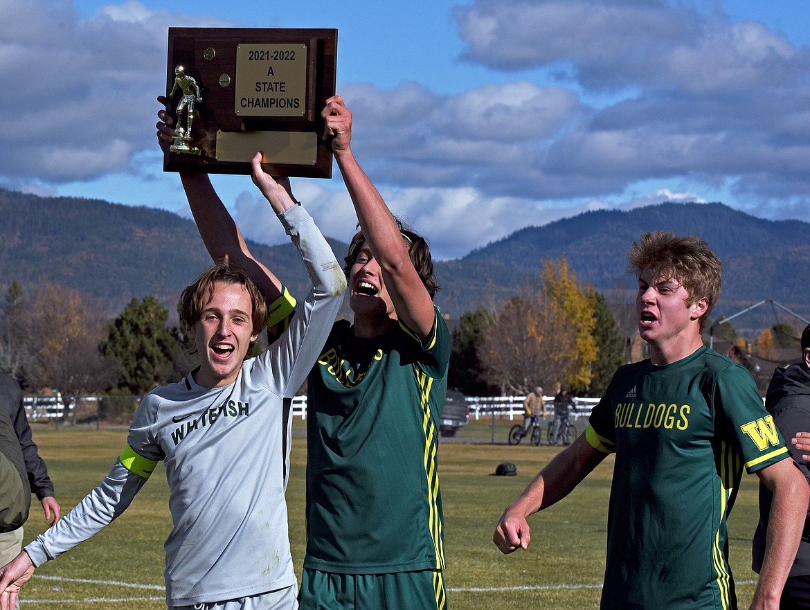 The Whitefish Bulldog boys soccer team celebrates winning its fourth-straight State A Championship on Saturday in Whitefish. (Whitney England/Whitefish Pilot)