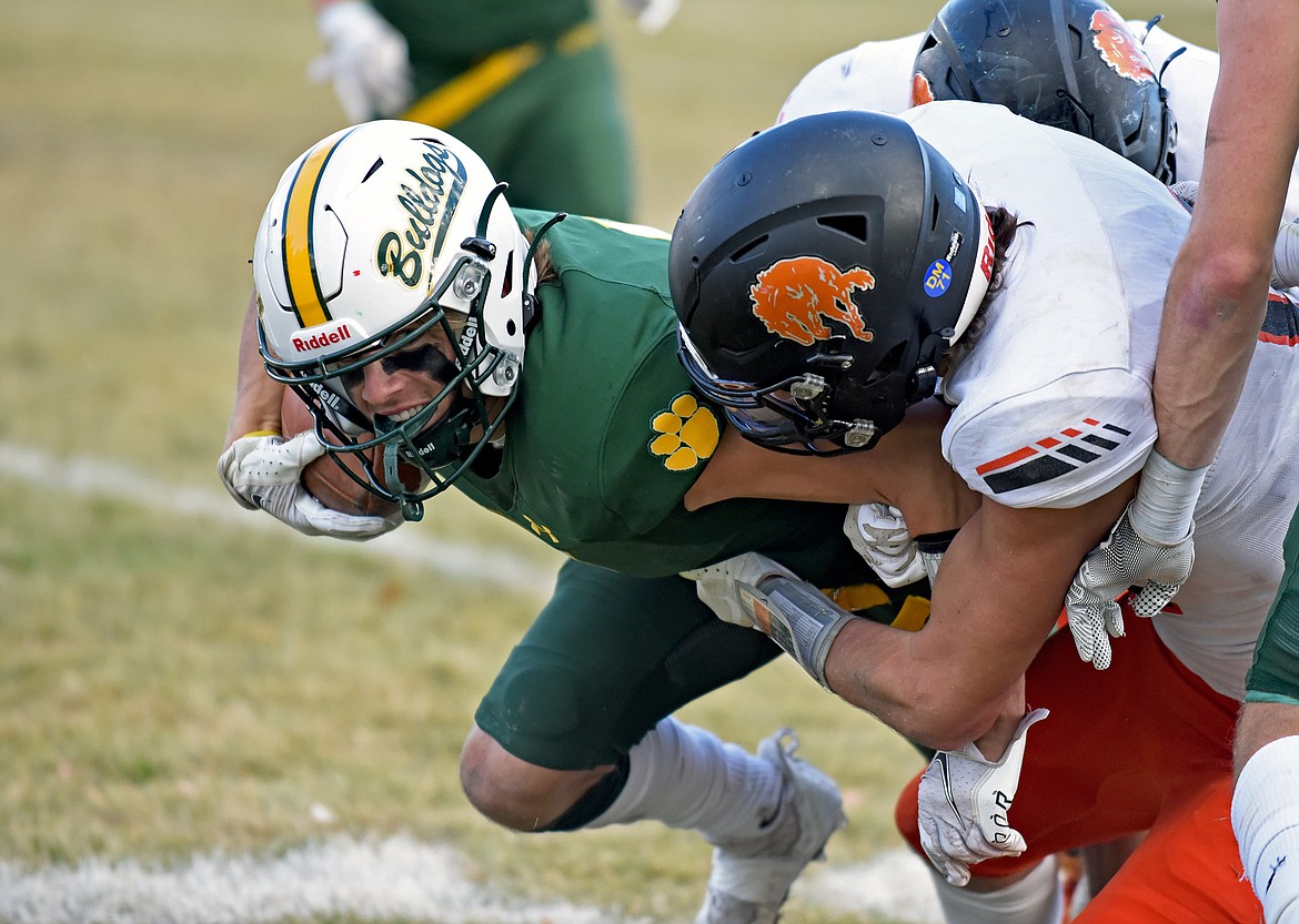 Whitefish receiver Jaxsen Schlauch works for extra yards while Broncs players attempt to make a tackle during a playoff game against Frenchtown this season. (Whitney England/Whitefish Pilot)