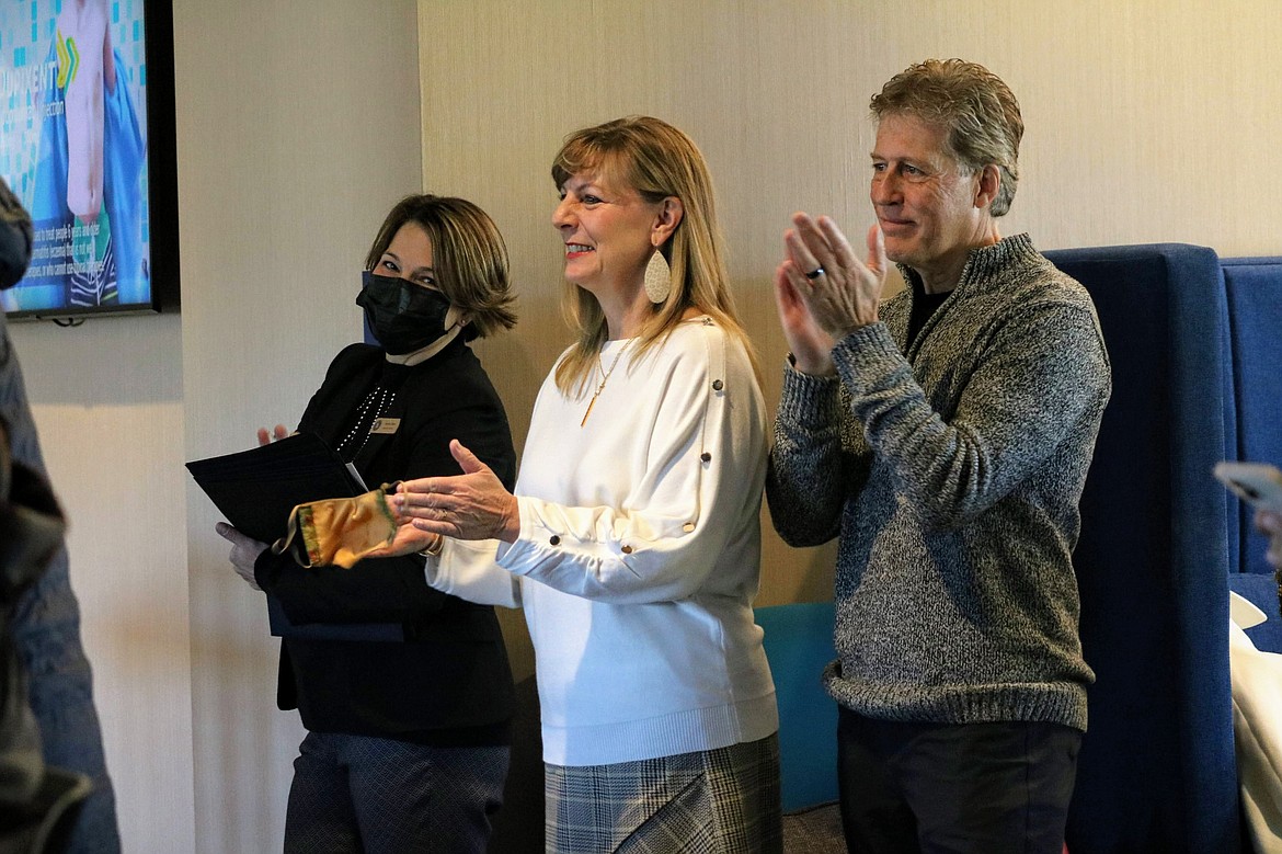 From left, Andrea Olsen and Pattie and Steve Mortier, Spokane Valley Summer Theatre affiliates, cheer for the announcement of the $36M project, the 59,000 square foot Spokane Valley Performing Arts Center, set to be completed in spring of 2024 with a 475-plus seating main stage theater, 200 seat studio theater, acting conservatory and more. HANNAH NEFF/Press